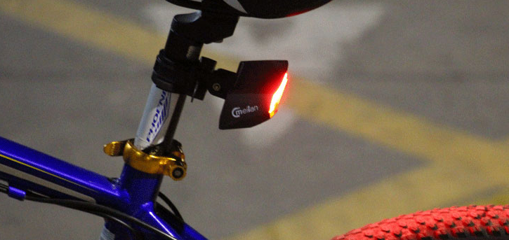 Prime District wireless bike tail light with LED directional turn signals and handlebar remote control.
